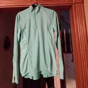 Aqua long sleeved athletic top. Zipper at top